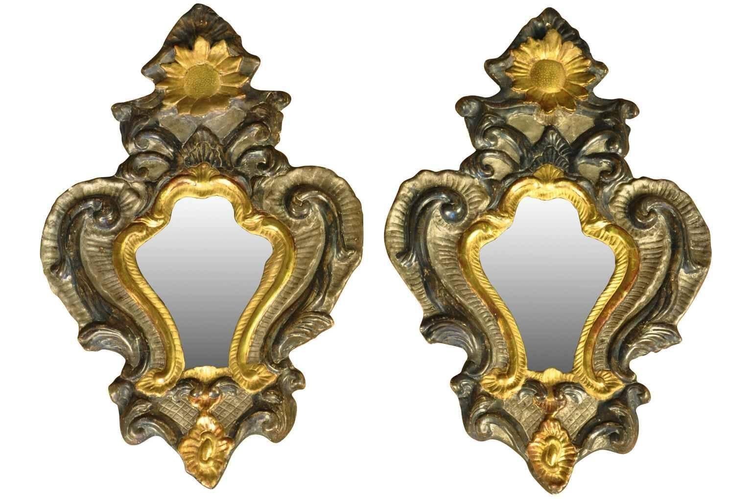 A striking pair of 18th century Venetian mirrors constructed from polychromed and gilt papier mâché and wood. Please note that this pair has been drilled towards the base to convert into sconces. There is a pair available.