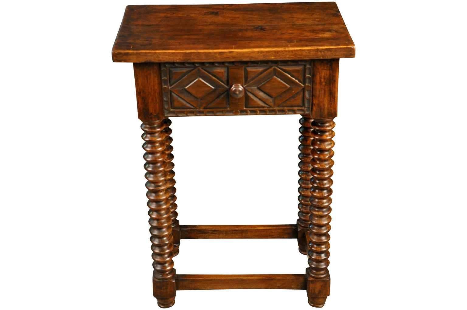 A charming 19th century Spanish side table. Beautifully constructed in walnut with nicely turned legs and a craved drawer fascia.