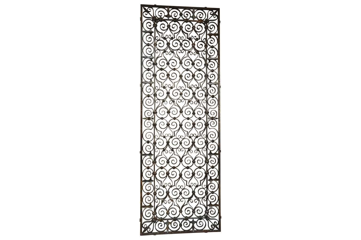 A very handsome 19th century wrought iron grille panel from Spain. A terrific piece to be inserted into a wall, to cover a window, or to be incorporated into a gate or door. The panel will also serve beautifully as a headboard.