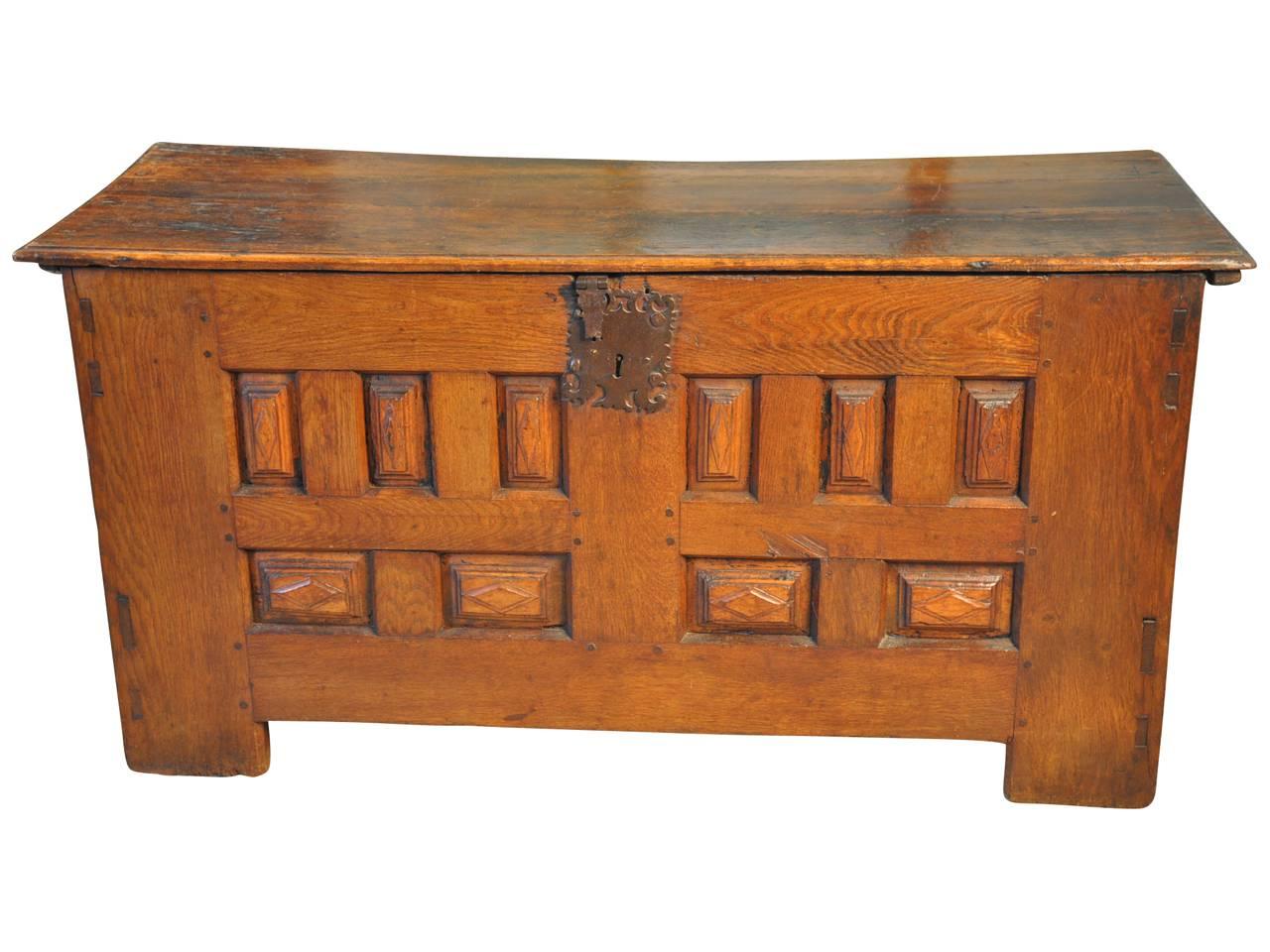 A very handsome French Louis XIII style trunk or coffer constructed from richly stained oak. A great storage piece. Wonderful under a picture window, at the foot of a bed or as a low sofa table.