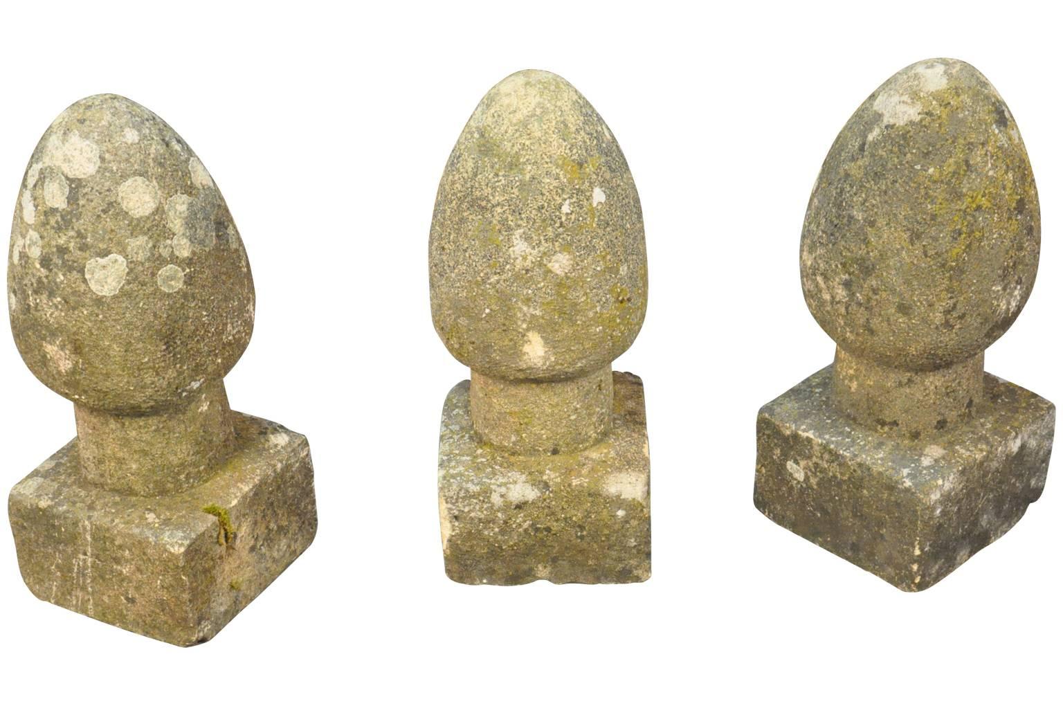 A wonderful set of three 19th century French stone garden finials. Beautifully and simply shaped in a conical orb atop a squared base. Perfect for any garden or as an interior decoration.