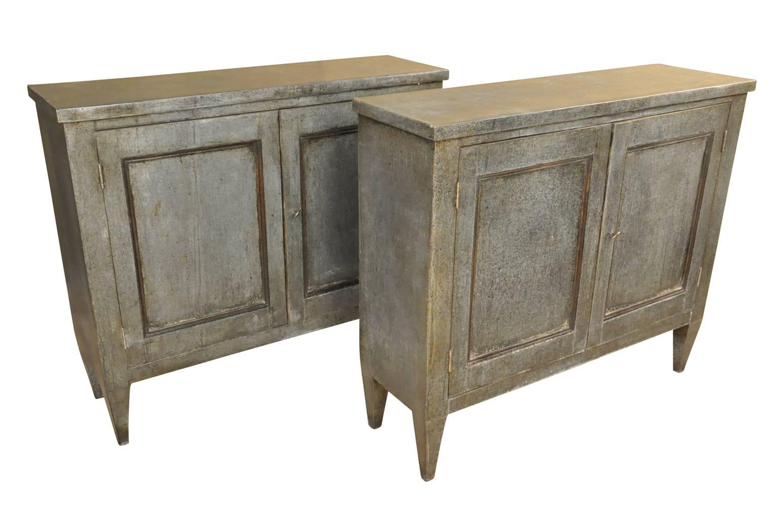 A fabulous pair of 19th century two-door buffets from the Catalan region of Spain. The buffets are wonderfully clad in zinc. Their minimalist design, along with the zinc cladding lends these pieces a very modern feel. The buffets may be sold as a