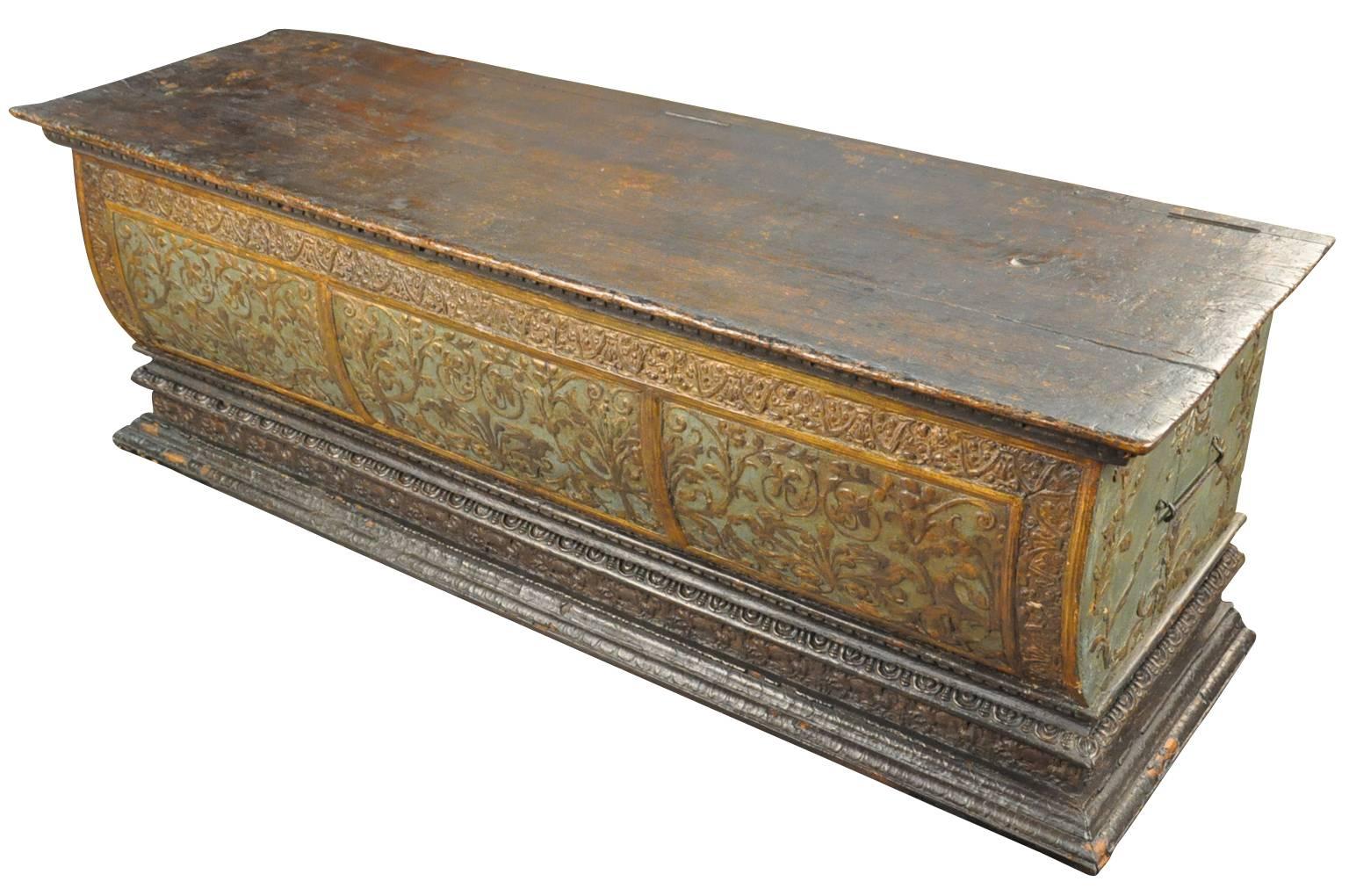 An exquisite 18th century Italian Baroque cassone or trunk from Northern Italy. Expertly polychromed and carved with a flowering vine motif. Fabulous patina. A stunning piece to place at the foot of a bed or in any living area.