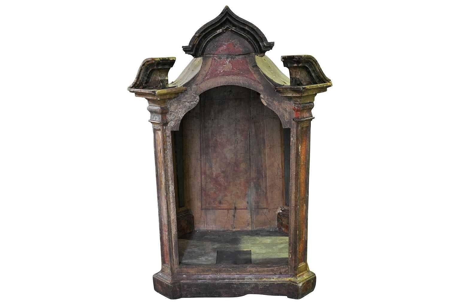18th century spanish polychromed tabernacle, niche for the display of Santos. Original finish in somber tones of ochre and siena.