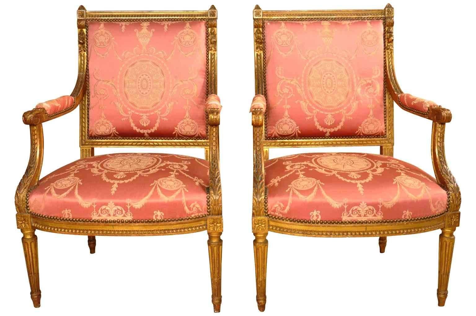 Pair of 19th century French Napoleon III period fauteuilles in giltwood. Beautifully constructed with padded arms and fluted legs. High quality gilt.