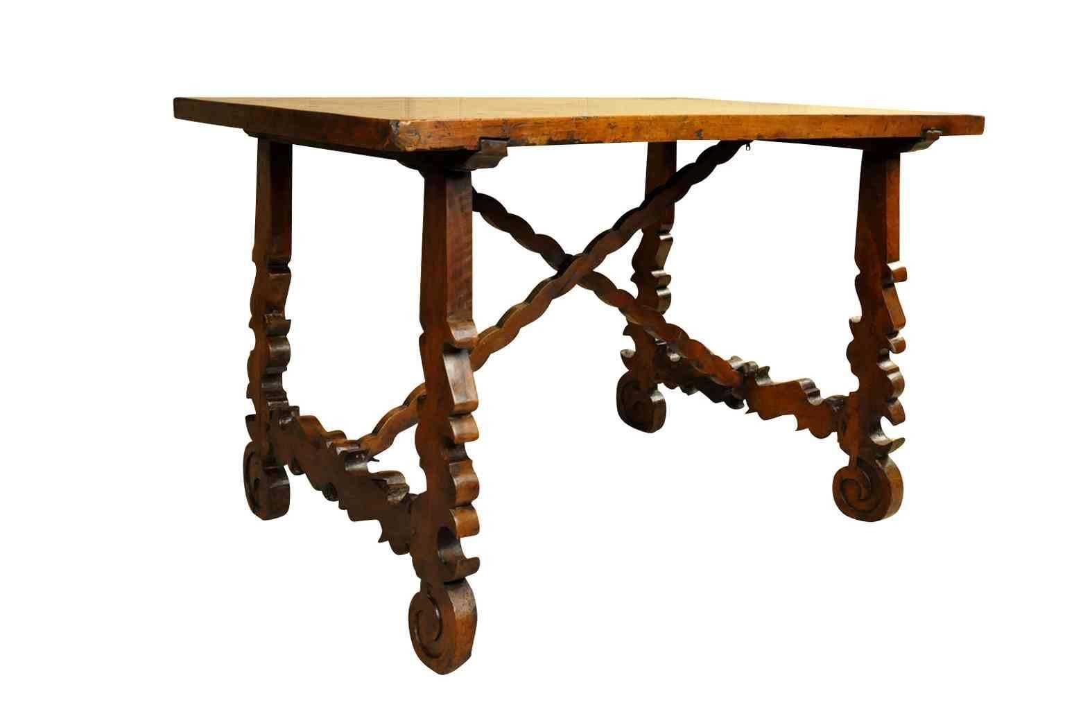 An exceptional late 17th century side table from the Catalan region of Spain. Constructed in walnut with a tremendous solid board top. The patina is outstanding - sumptuous and luminous. Beautifully sculpted lyre legs. Serves wonderfully as a