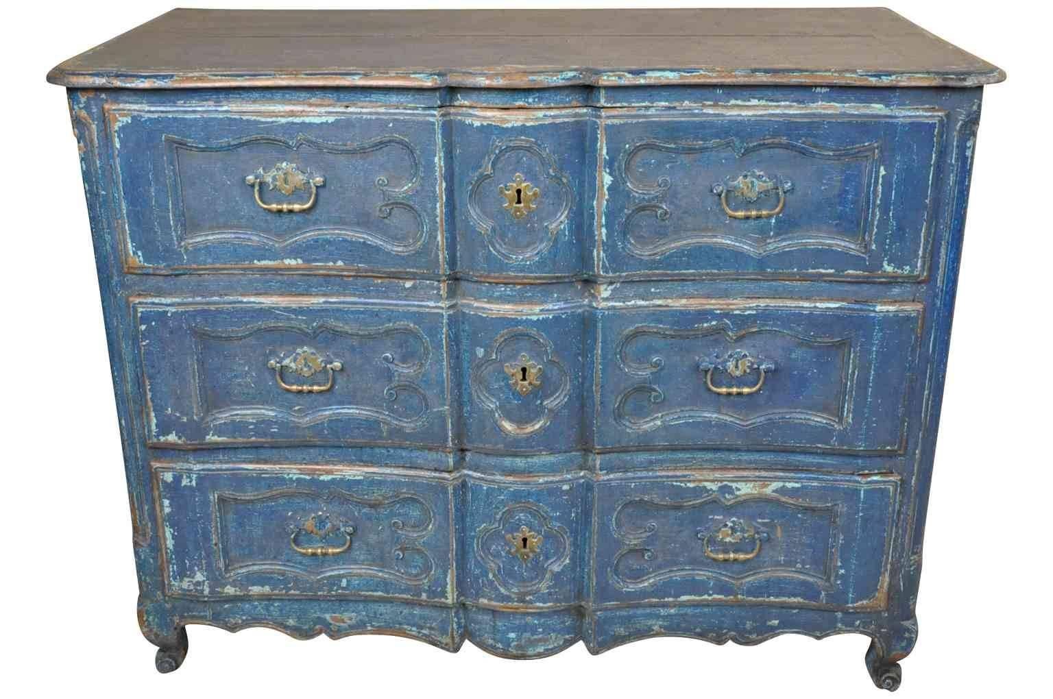 A French provencal 18th century commode in the arbalete form. Soundly constructed in painted wood with three drawers and a cabriole feet. A wonderful patina and painted finish. This piece would also be terrific converted into a bathroom or powder