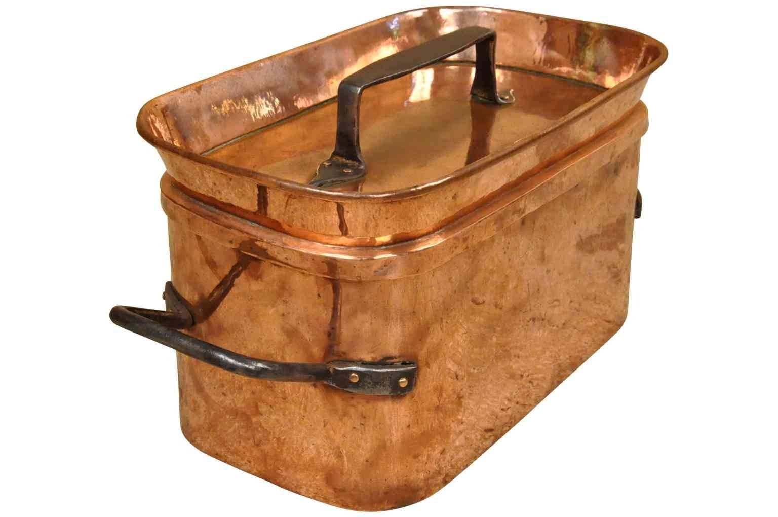 A very handsome and very heavy gauge French 18th century lidded copper cooking pot or stewing pot with hand-forged iron handles.