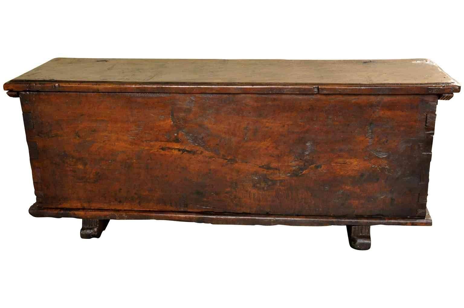 A very handsome 18th century cassone or storage trunk from Northern Italy. Beautifully constructed in hand hewn very thick planks of walnut. The graining and patina are simply exceptional. Mortise and tenon joints, raised on feet. Wonderful at the