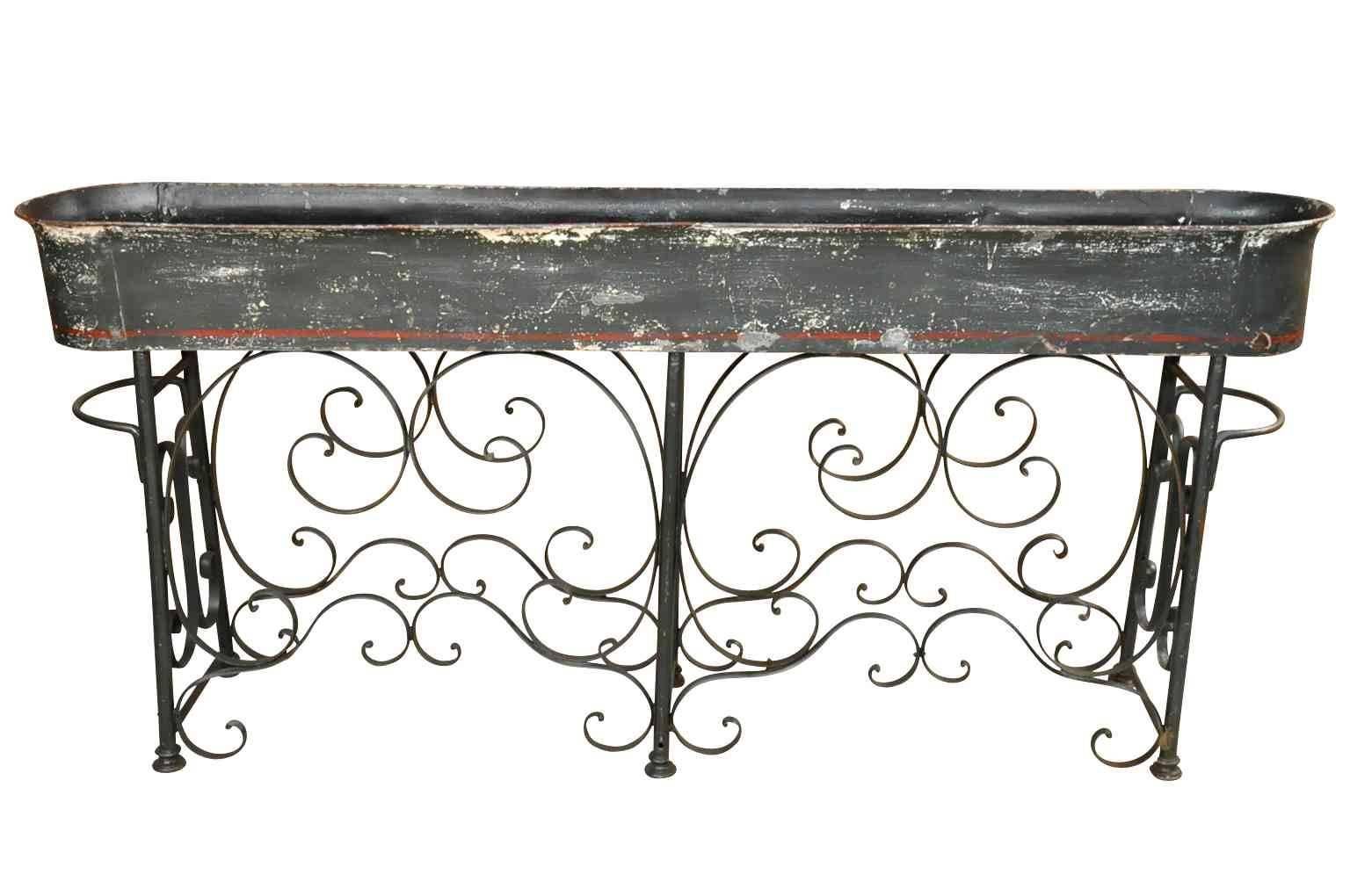 A wonderful grand scale French Jardinière stand in painted iron and zinc. A terrific addition to any garden, porch or solarium.