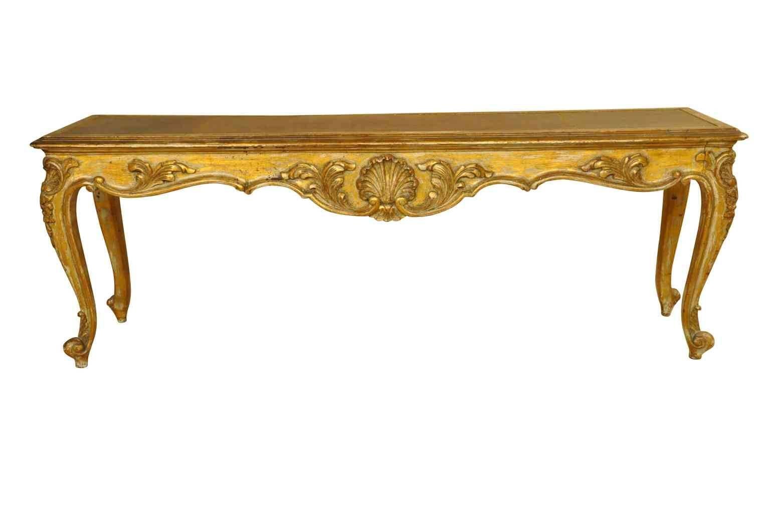 Spanish Louis XV style bench banquette handsomely constructed in giltwood with leather seat insets. A lovely accessory, perfect at the foot of a bed.