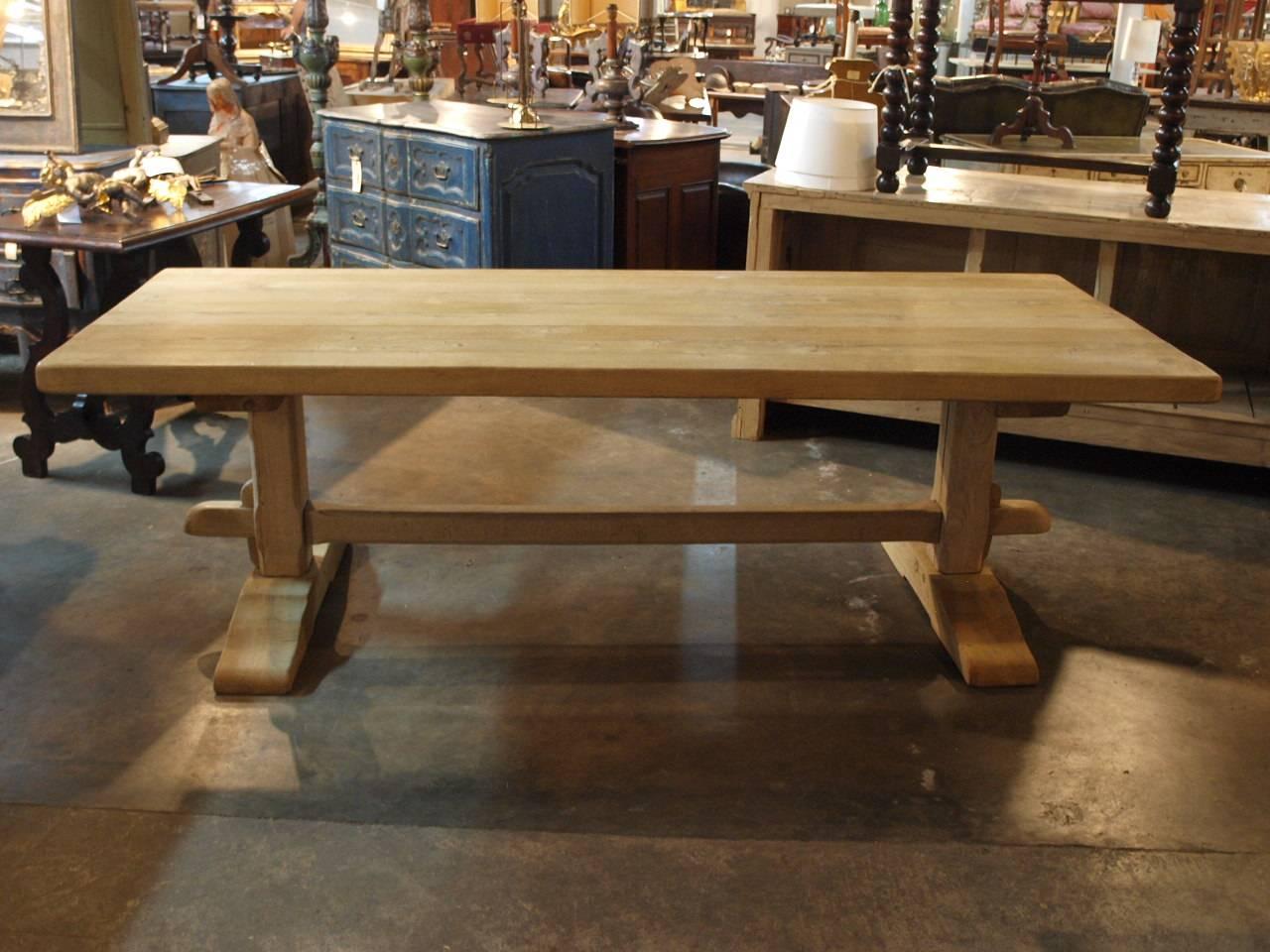 A very handsome late 19th century turn of the century farm table, trestle table beautifully constructed from washed or bleached oak. Wonderful as a large writing table as well.