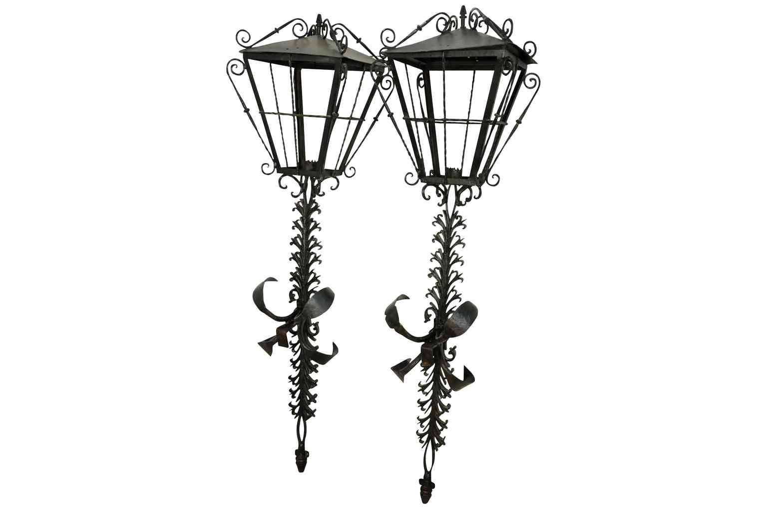 A fabulous grand pair of iron lanterns from the Catalan region of Spain. Excellent craftsmanship. A definite statement to any entryway.