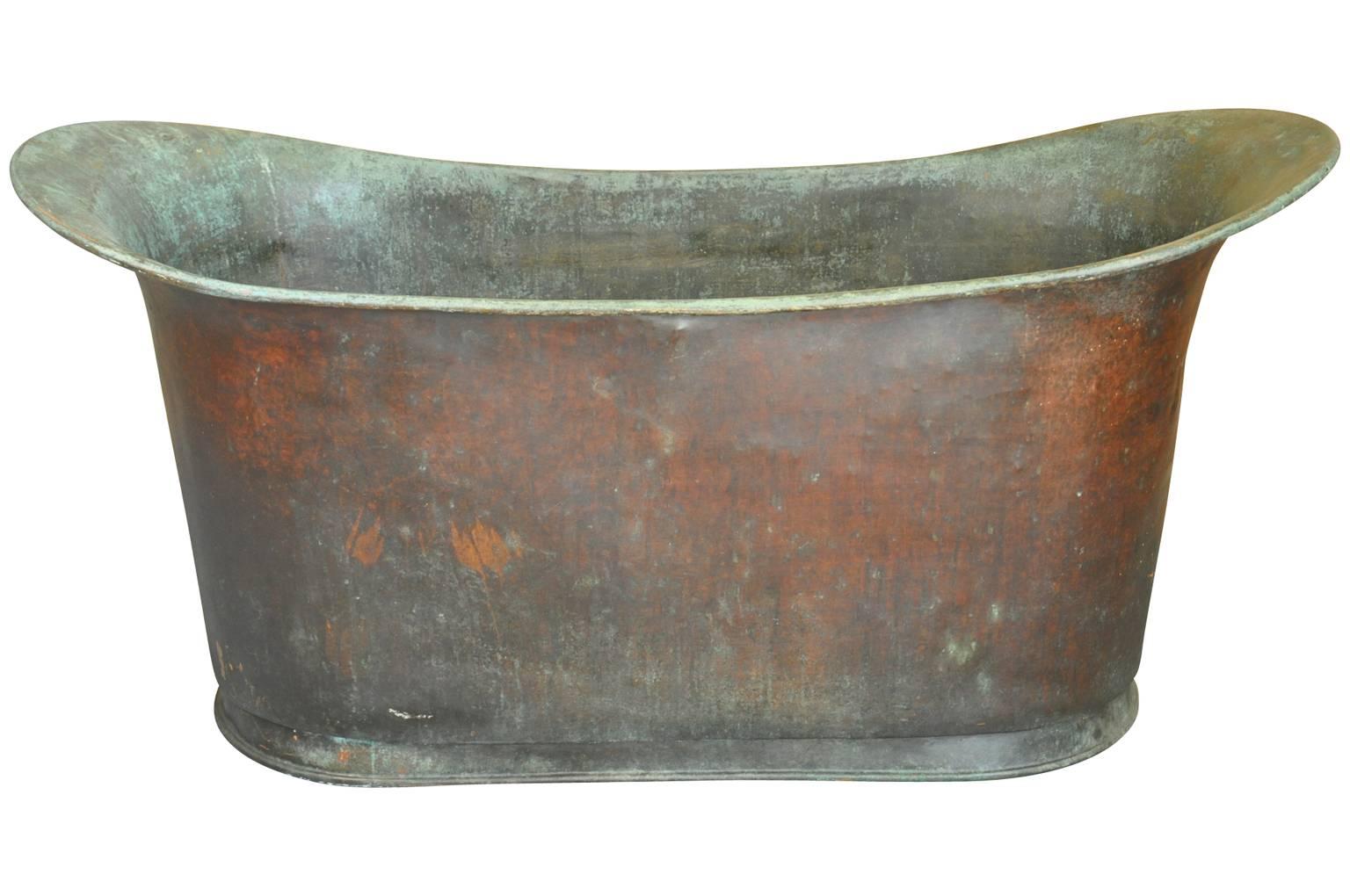 A fabulous mid-19th century slipper shaped copper bath tub from Corsica, France. Beautifully crafted from a heavier gauge copper with a nicely rolled edge finish. Not only wonderful as a bath tub, but can serve as a terrific container to ice down