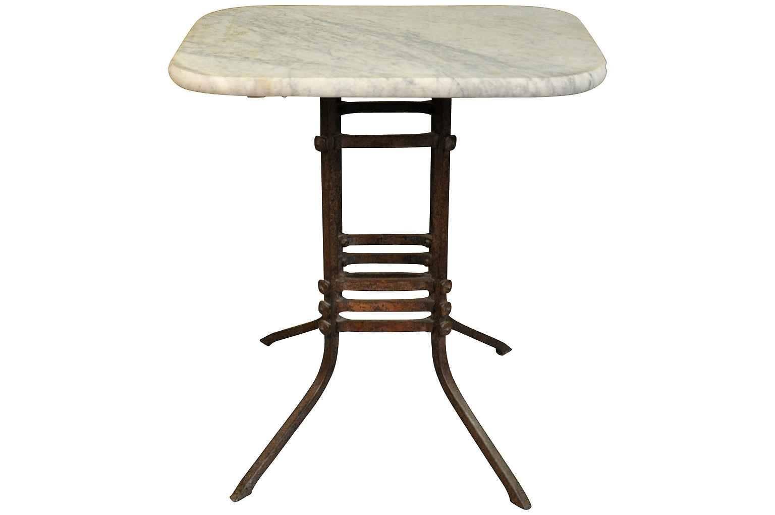 A wonderful 19th century French rectangular shaped gueridon in forged iron and marble top. The base is expertly crafted lending the table an Arts and Crafts feel. A perfect occasional table for any interior of garden.
