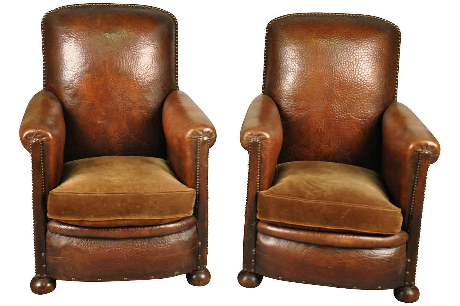 A fabulous pair of French Art Deco leather club chairs. Beautifully constructed with handsome nailhead detailing. Very sound and very comfortable.