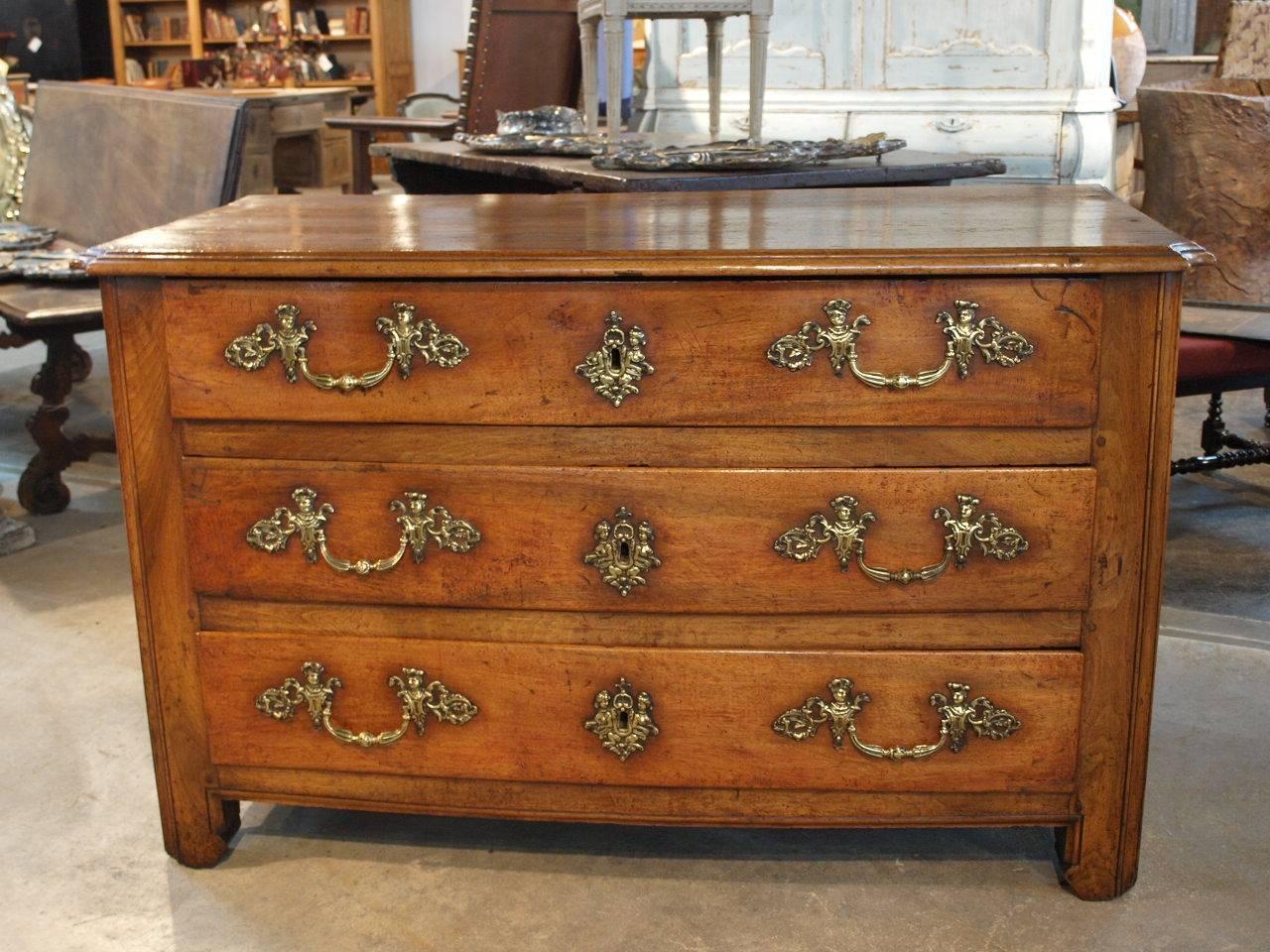 A very fine French Louis XIV period commode. Masterly crafted in walnut with original drawer pulls and locks. Wonderful patina and graining luminous and rich.
