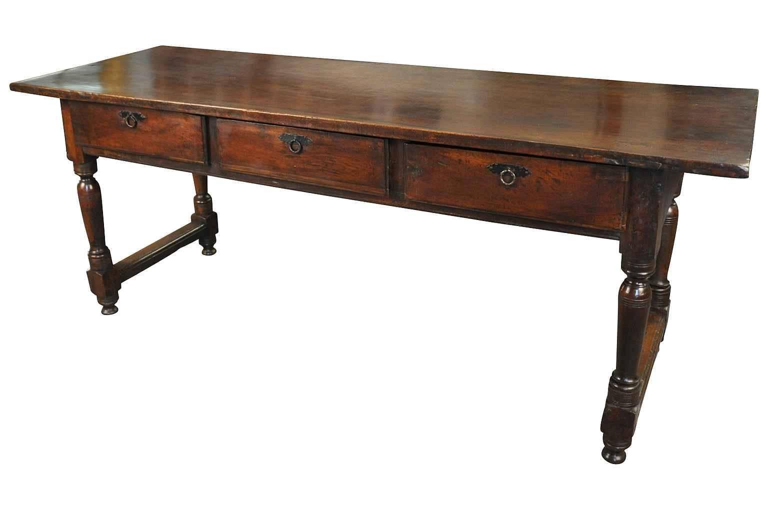 A very stunning 18th century three-drawer console from the Catalan region of Spain. Wonderfully constructed from walnut with an impressive solid board top. Fabulous patina and graining. Not only terrific as a console, but serves wonderfully as a