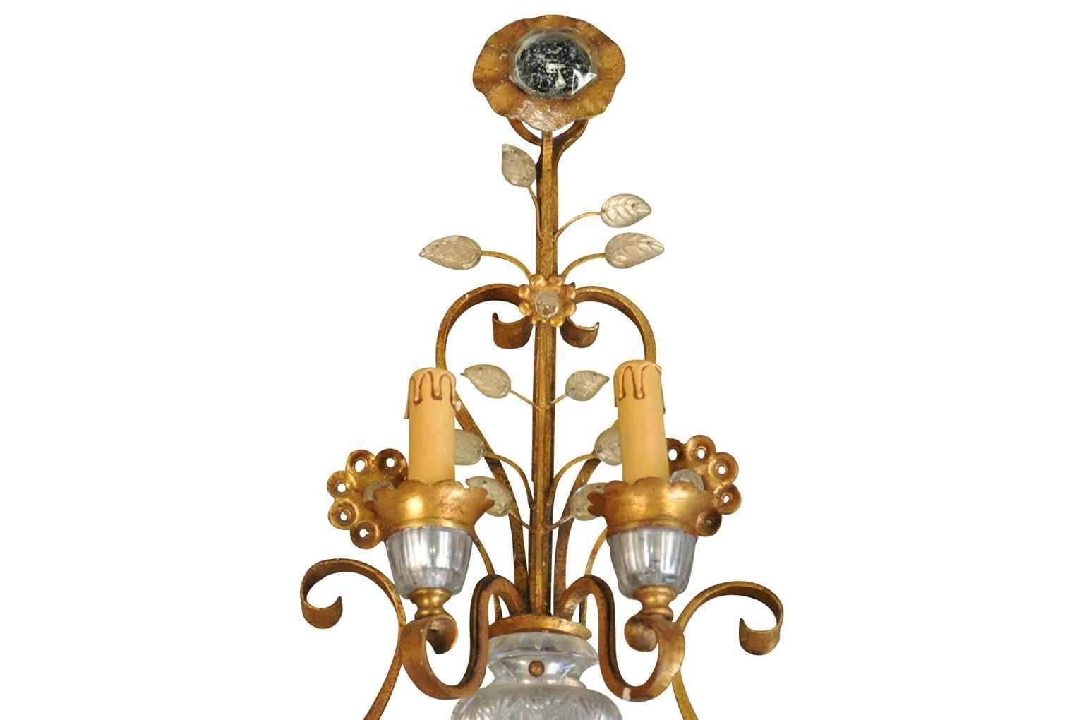 A stunning Maison Baguès applique - sconce, Paris, circa 1920. Expertly crafted with the classic Maison Baguès technique of mounting glass over silvered and gilded metal. Stunning.