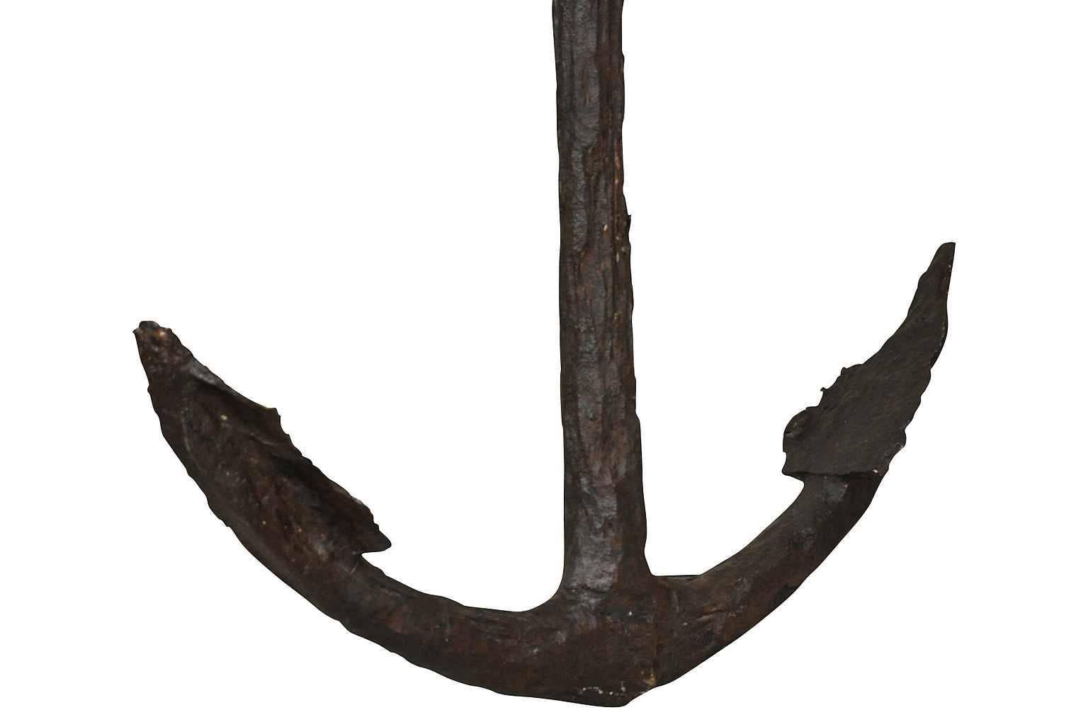 An outstanding and large French 18th century anchor found in the Mediterranean Sea off the coast of Nice, France. Beautifully hand-forged iron. Fabulous patina. Wonderful as a wall-mounted art piece or as a poolside or beach house accent.