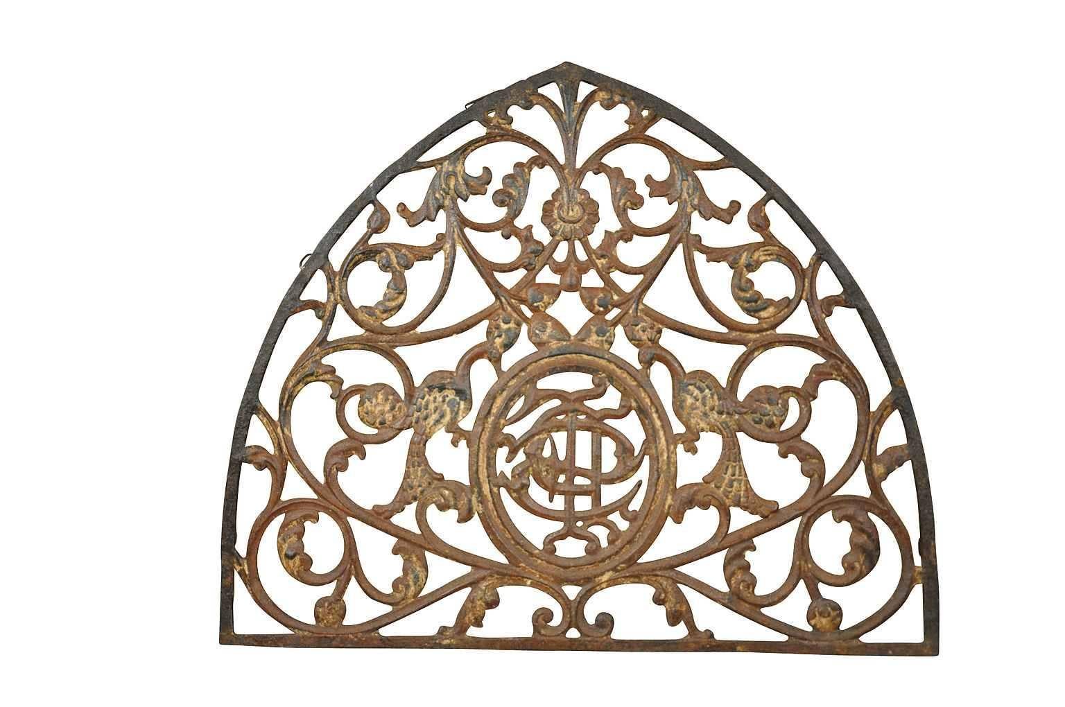 A wonderful French 18th century Gothic style architectural fragment - over door pediment. Expertly crafted in cast iron and retaining traces of the original paint. Wonderful s a wall-mounted piece, converted into a mirror or incorporated into a