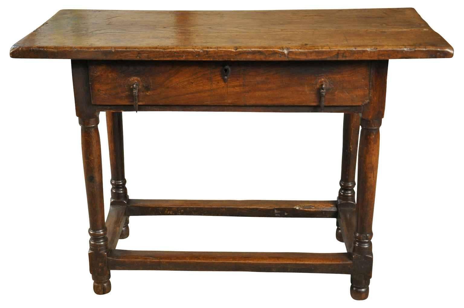 A very charming early 19th century Primitive French side table - console. Wonderfully constructed from chestnut with a solid board top, single drawer and nicely turned legs. A terrific occasional piece. Rich and luminous patina.
