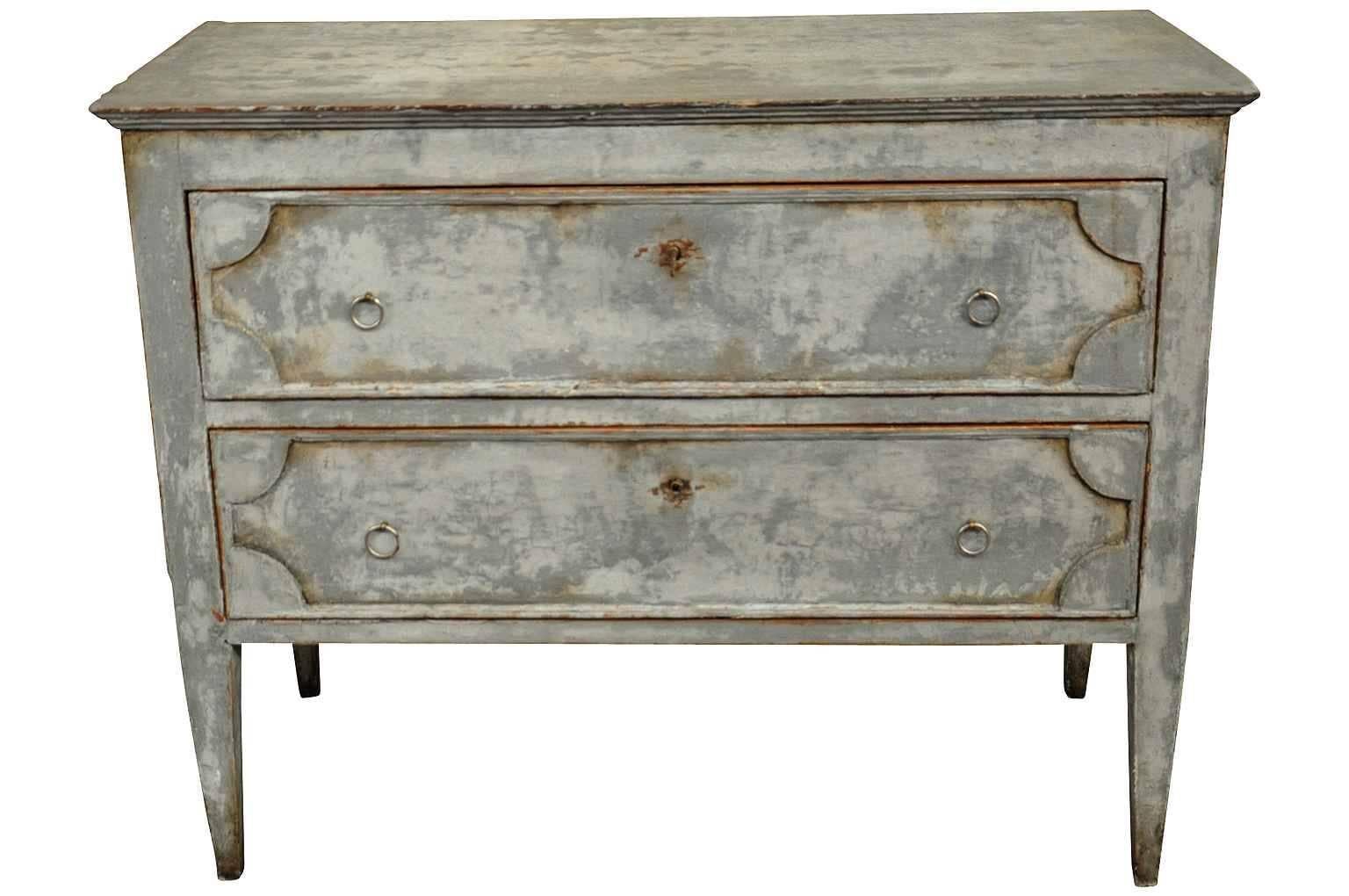 A very handsome later 19th century commode in painted wood. Terrific painted finish in a zinc-like tone. Beautifully constructed with a surface edge finish, molded panel drawer fronts and sides, and nicely tapered legs. Wonderful as a bedside table