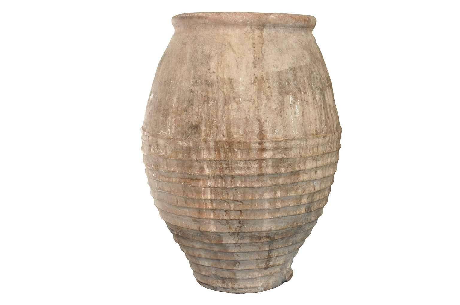 A wonderful terracotta olive jar from the Catalan region of Spain. Beautiful patina. A perfect piece for any interior of garden.