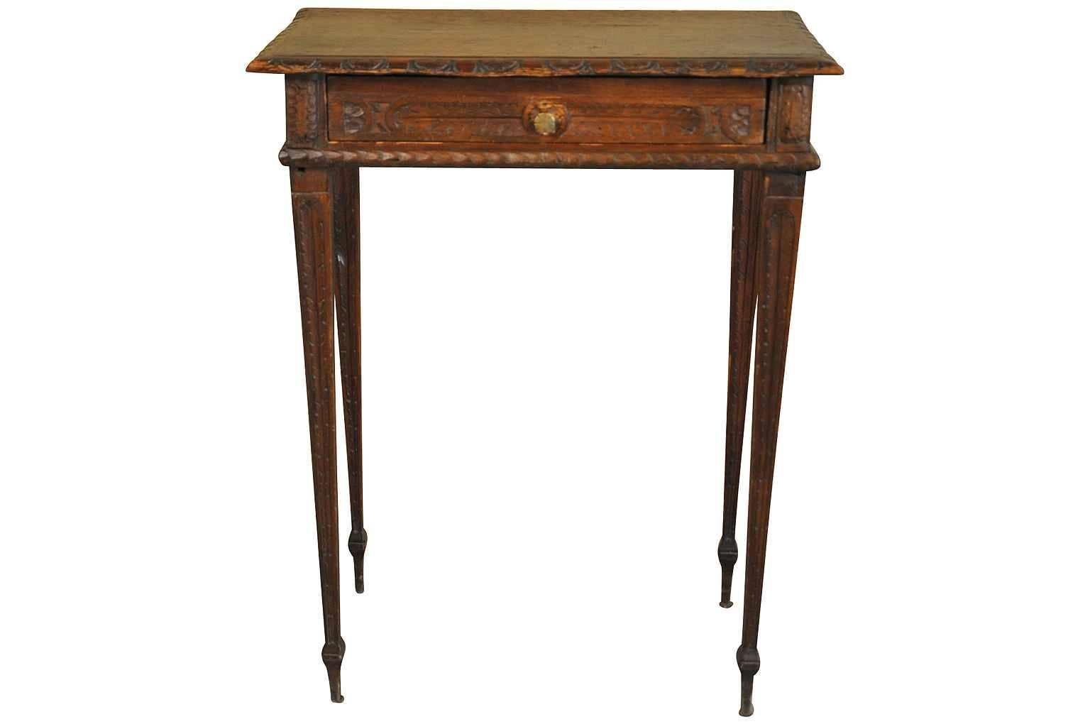 An absolutely charming French Louis XVI style side table or end table from France. Beautifully constructed in richly stained pine wood. Beautiful carved edge finish, one drawer over elegant tapered legs.