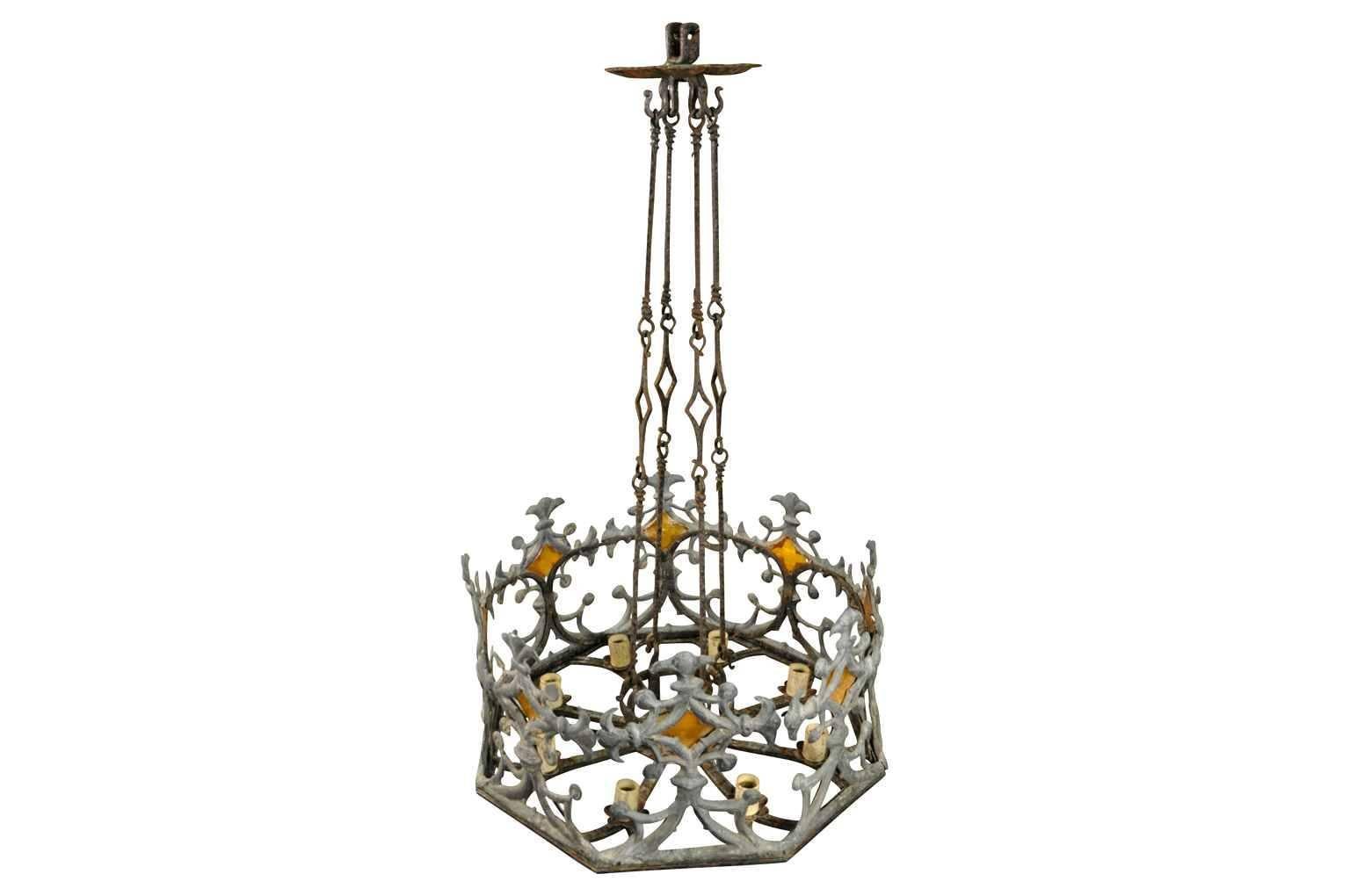 A fantastic mid-19th century French chandelier constructed from iron, lead and amber glass. A stunning statement.