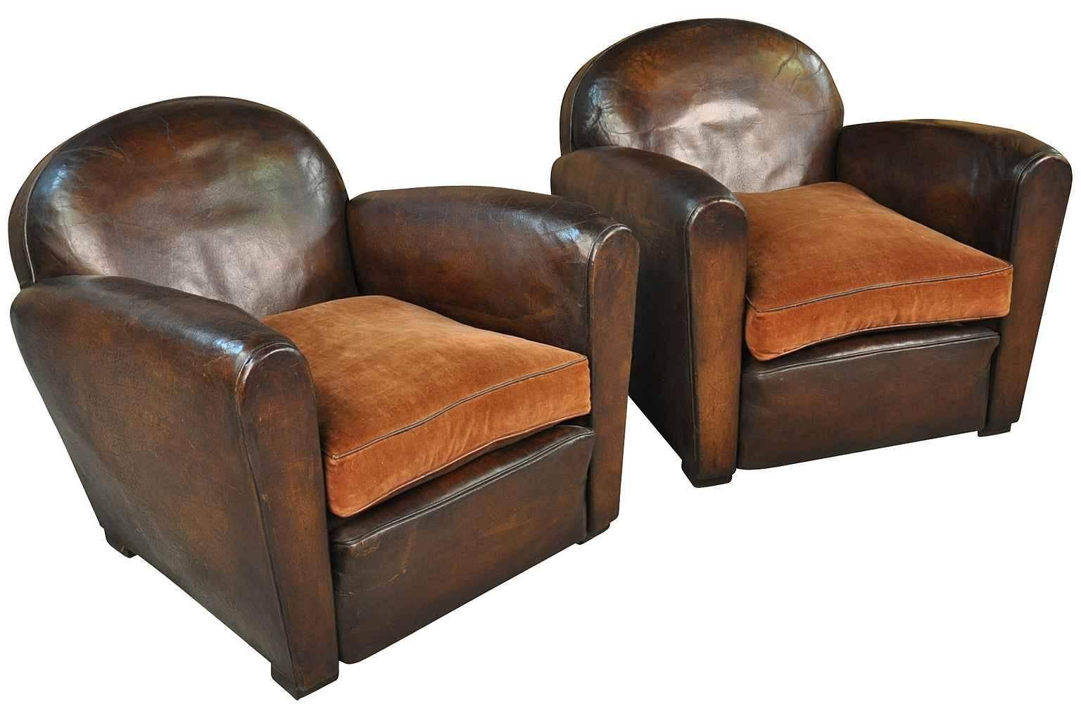 A sensational pair of French Art Deco club chairs in leather. Terrific form and patina. Measures: The seat height is 18