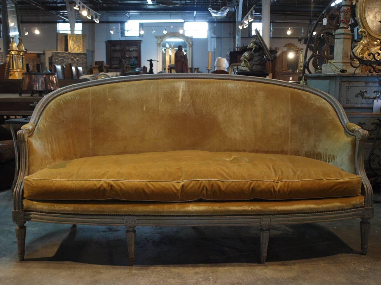 An exceptional pair of 19th century Louis XVI style banquettes, sofas. Beautifully constructed with the original painted finish. The pair is in excellent condition, very sound, very sturdy. Their larger scale makes this pair indeed outstanding.
