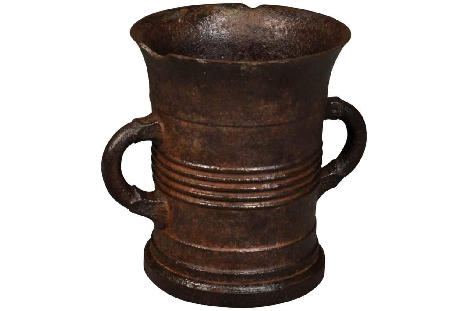 A wonderful 18th century French cast iron mortar. A great vessel for flower arranging or storing kitchen utensils.