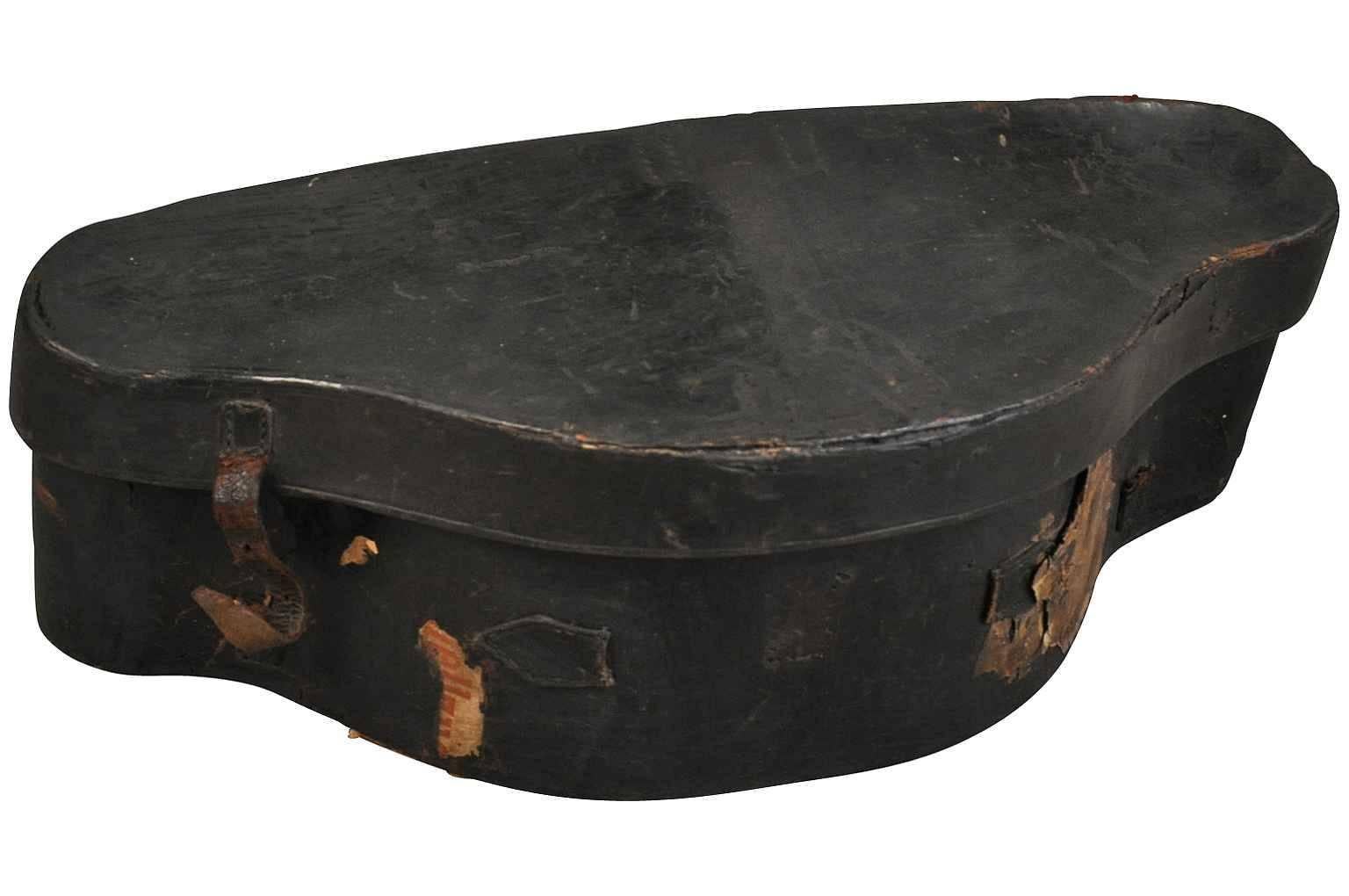 A sensational early 19th century French Chapeau De Gendarme - officer's hat box in leather. Such a nostalgic shape!! A great accent piece for any bookcase or tabletop.