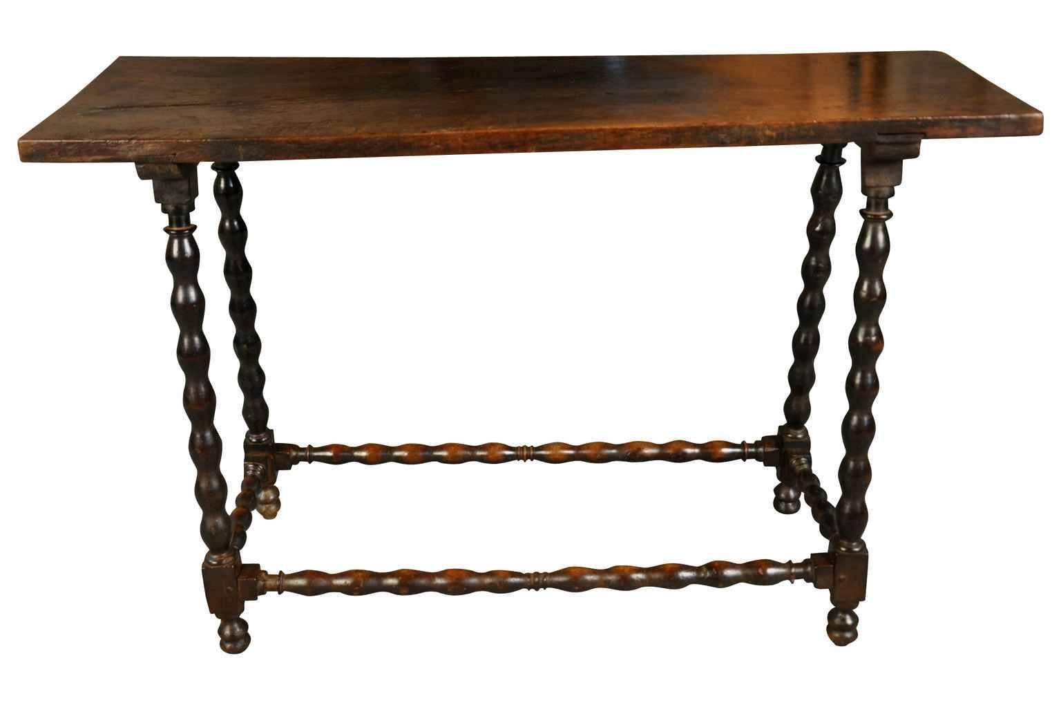 A very lovely Spanish 18th century console table. Beautifully constructed from walnut with a solid board top and nicely turned legs and stretchers. Wonderful patina and graining. A perfect sofa table!