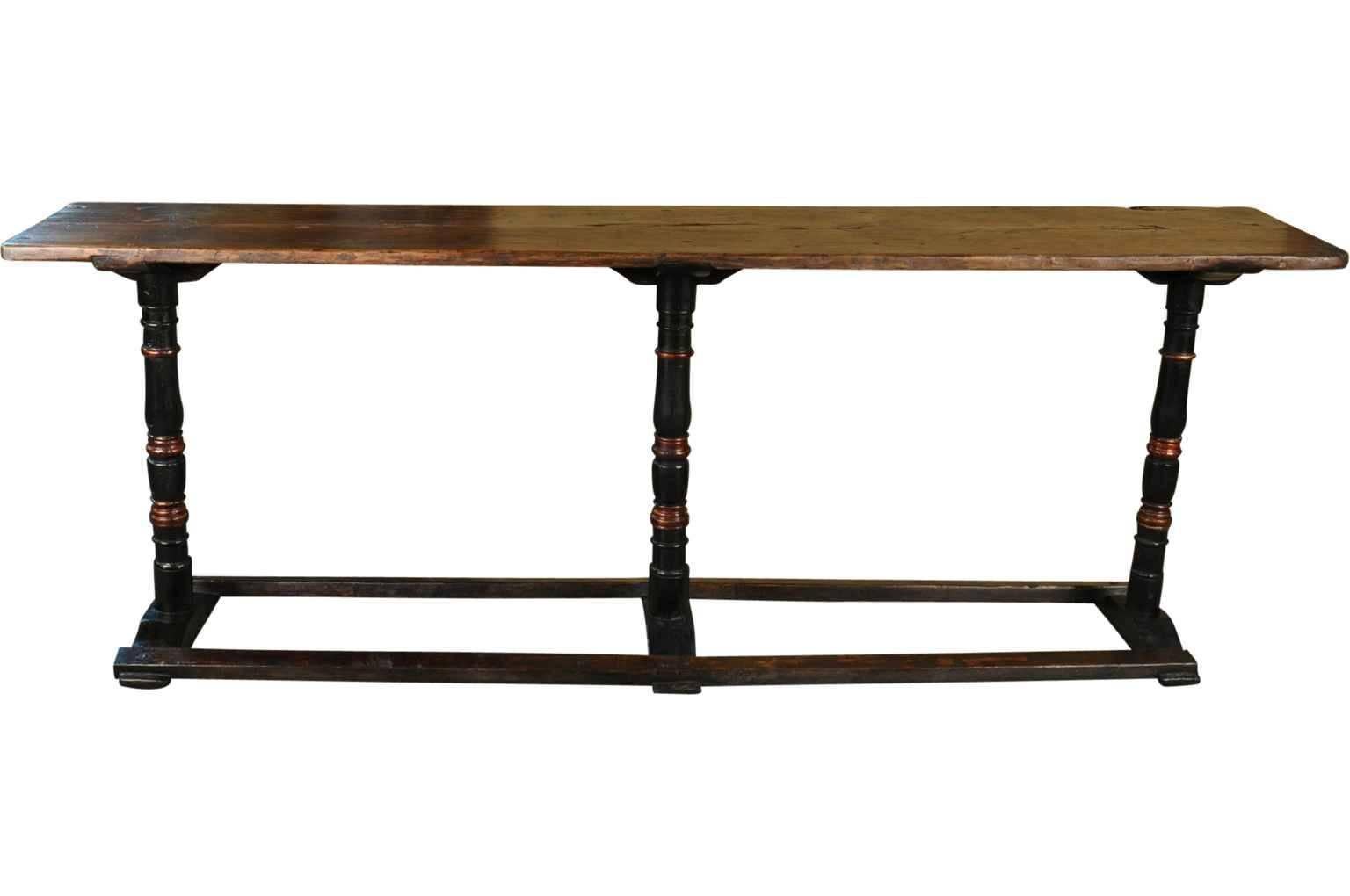 A very handsome 18th century long console table in painted wood. Its unique design and its wonderful patina make this console a wonderful accent piece.