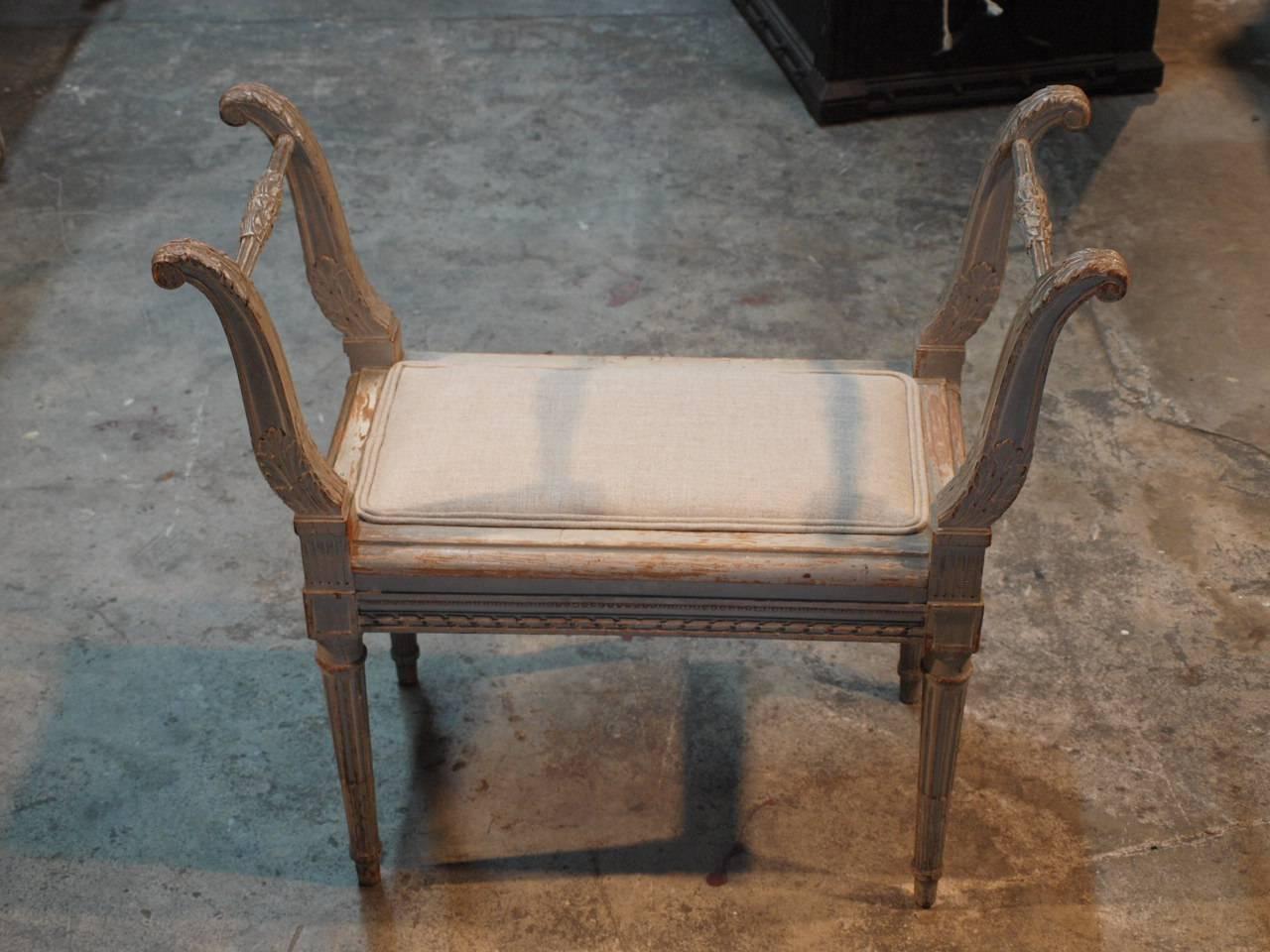 A very charming French late 19th century Louis XVI style banquette or vanity stool in painted wood and newly upholstered seat. Wonderful painted finish in hues of very soft sage with a hint of very light grey.