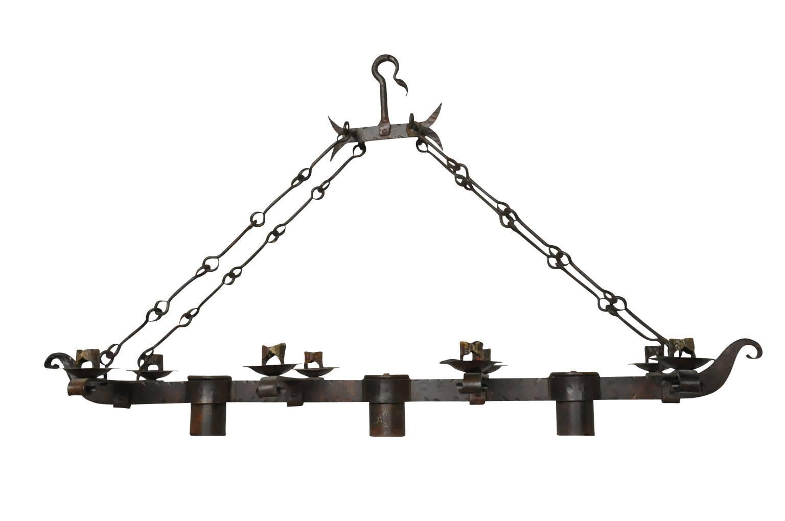 Very handsome Spanish rectangular shaped chandelier in handsomely worked iron. Wonderful over a kitchen island.
