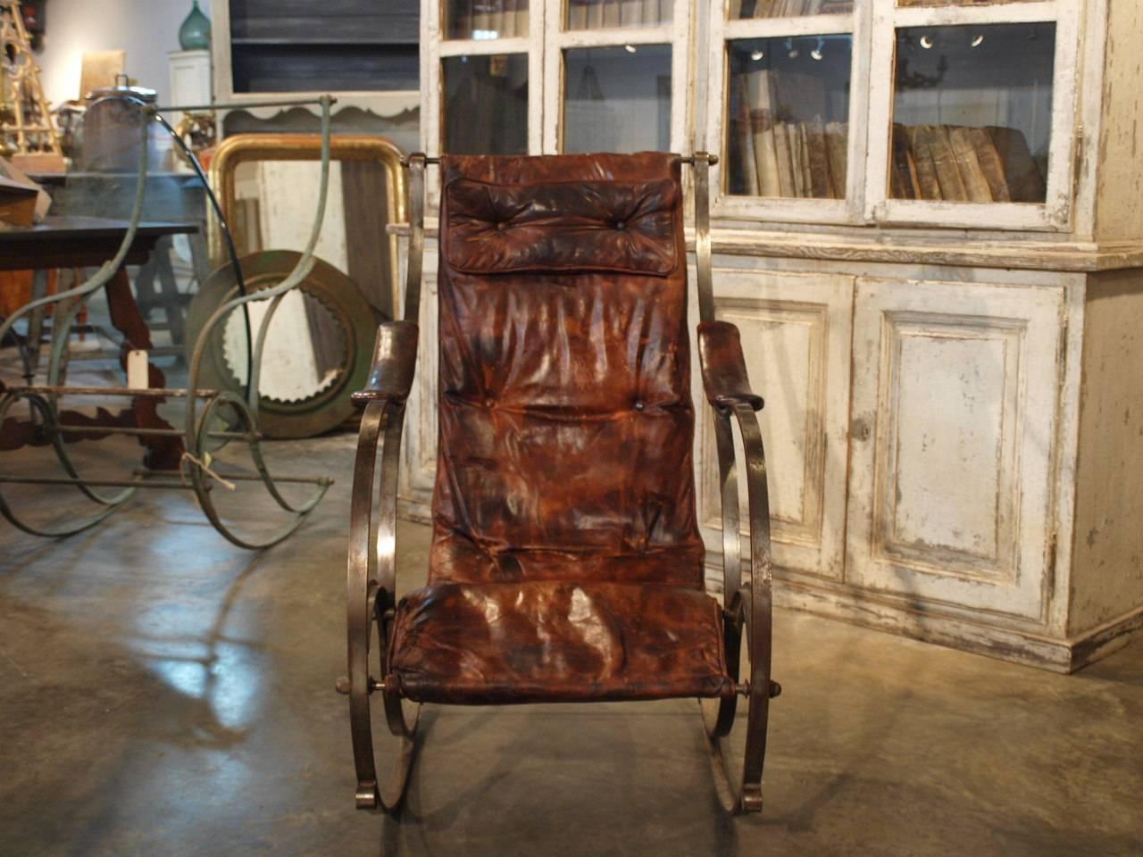 A terrific English spring steel and leather rocking chair attributed to RW Winfield, Birmingham England. The original patent for this model was created in the mid-19th century.