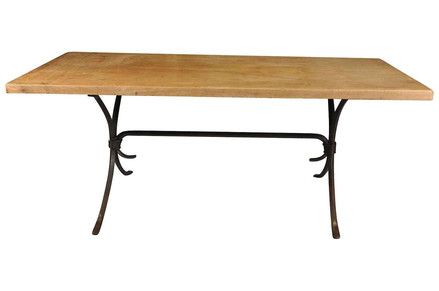 A wonderful early 20th century table from Northern Italy. Handsomely constructed with a fabulous hand-forged iron base and a hand hewn two board walnut top. Serves wonderfully as a writing table as well.