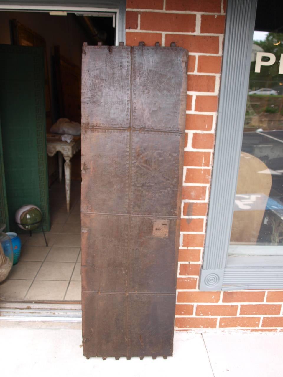 A very handsome 17th century hand hewn solid board walnut panel. Originally, this panel was the fascia to a very large traveling trunk. The panel has wonderful carvings of flowers, chickens and hand prints. Wonderful as wall-mounted art, a headboard