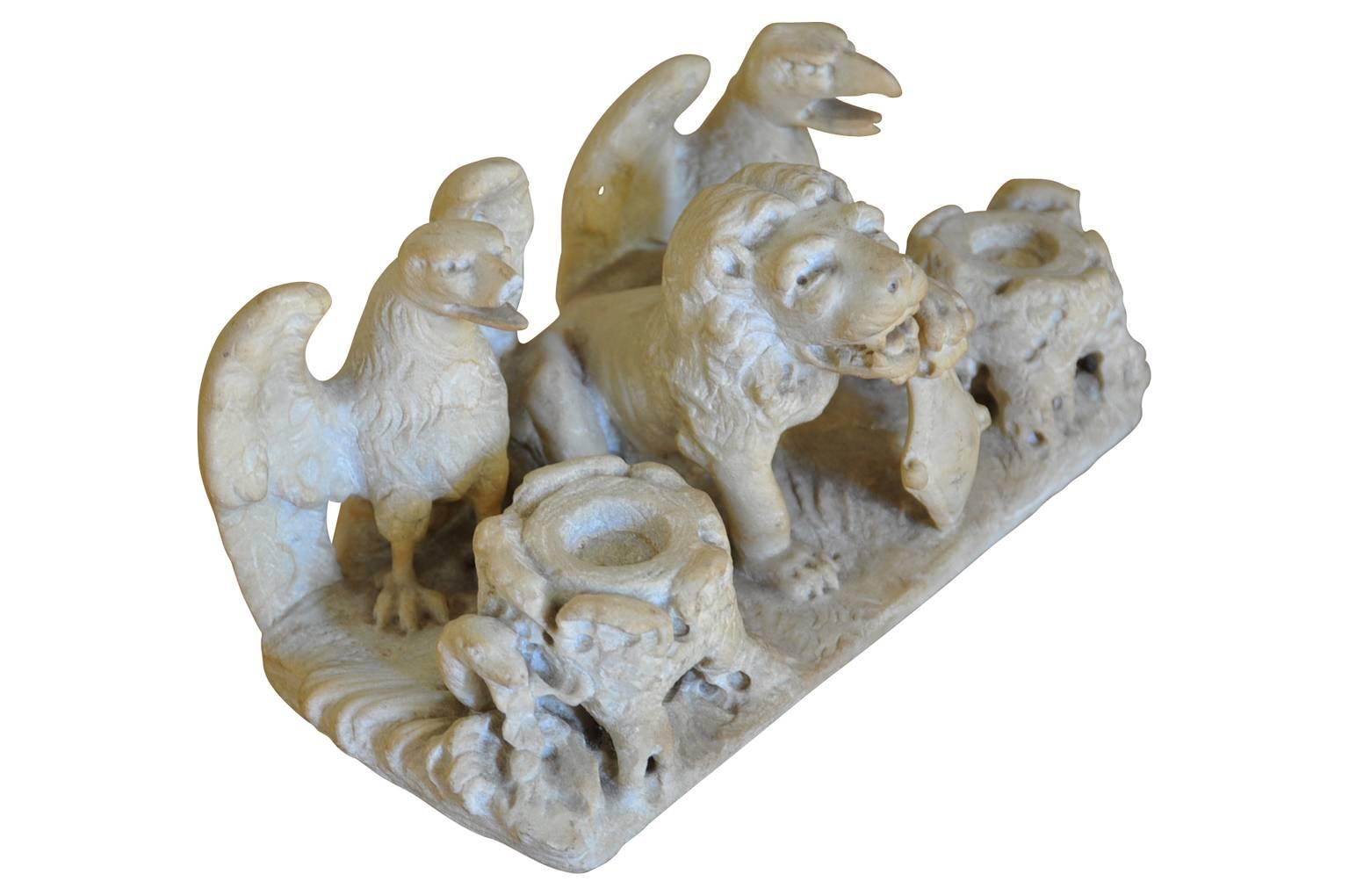 A sensational mid-18th century inkwell from the Veneto region of Italy. Masterfully carved from marble with two eagles and a stately lion holding a shield. A wonderfully accessory for any desk.