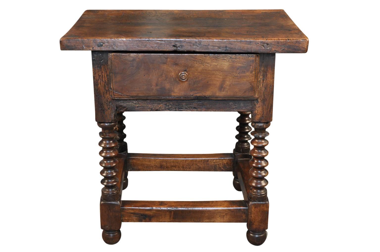 A very charming 18th century Spanish side table from the Catalan region of Spain. Wonderfully constructed from walnut with a single drawer and nicely turned legs. Outstanding patina.