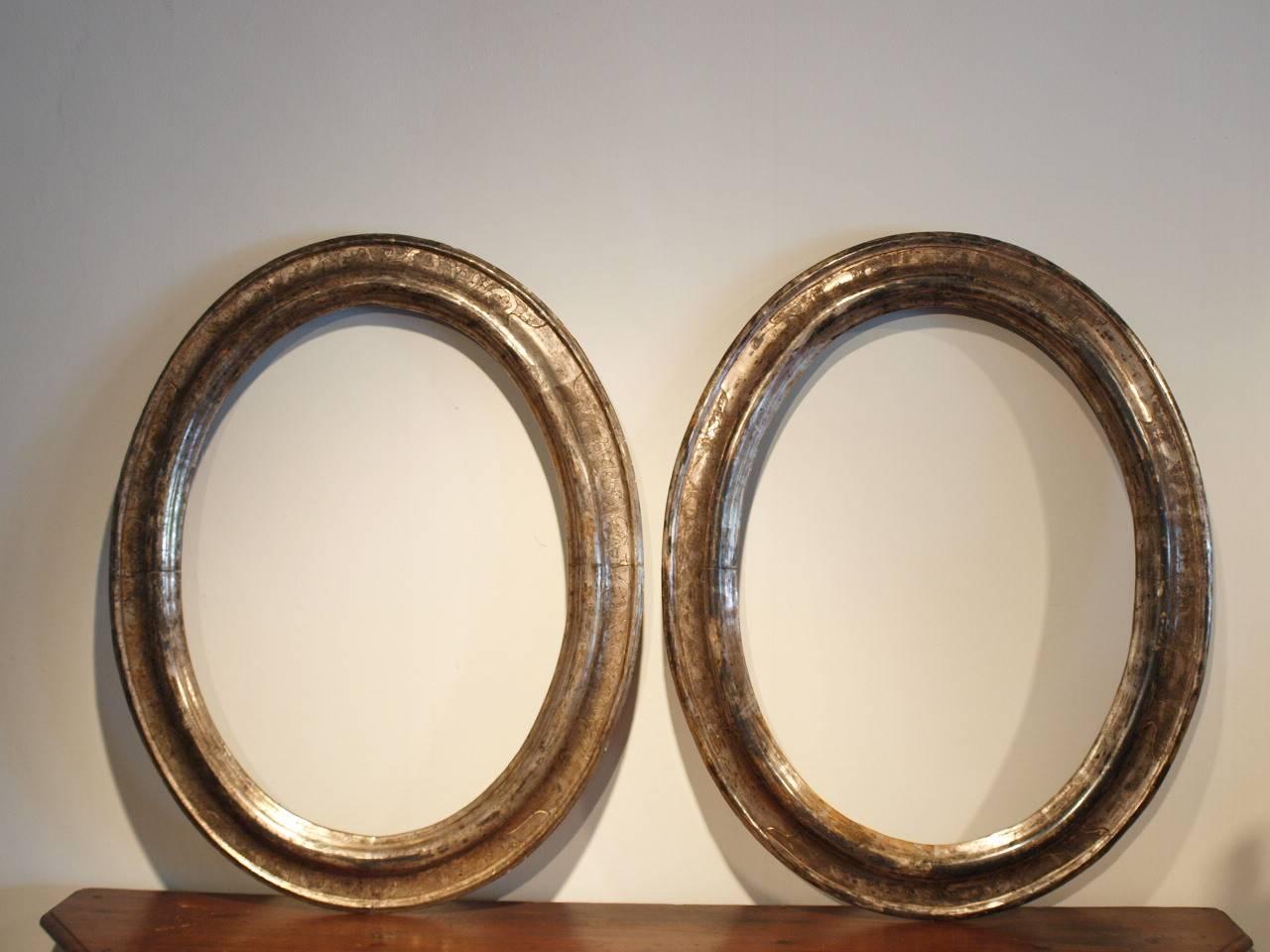 A sensational pair of 18th century silver gilt frames from Northern, Italy. Outstanding quality and patina. Terrific for housing paintings or mirrors.