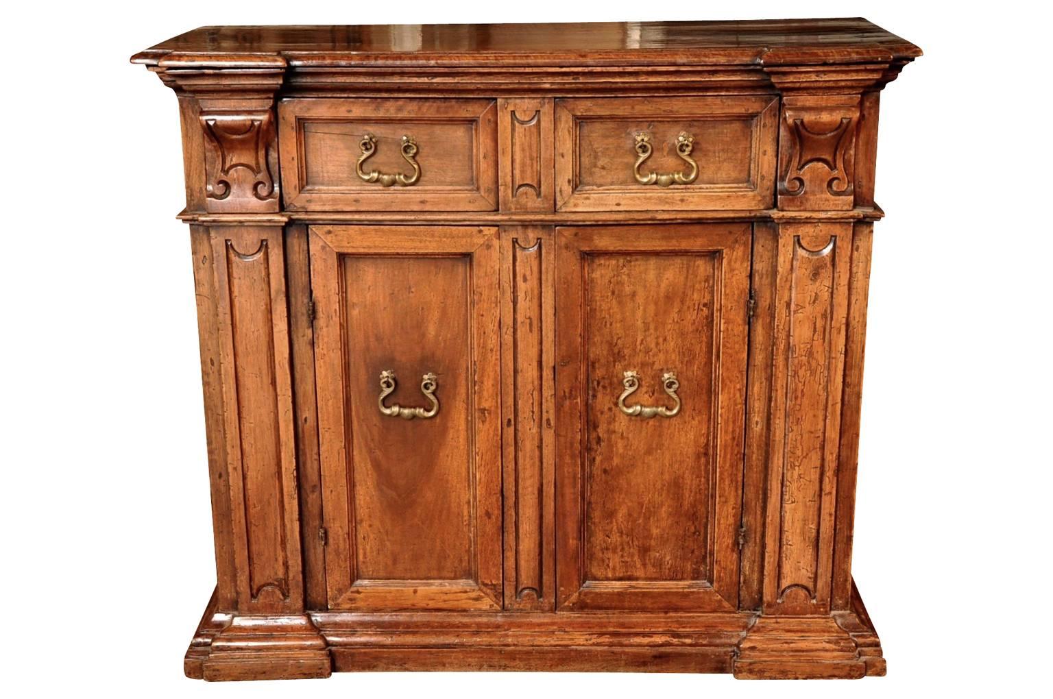 A very handsome late 18th century credenza from the Veneto region of Italy. Soundly constructed from walnut with double doors and five drawers.... Two that are seen and three that are hidden - very interesting.