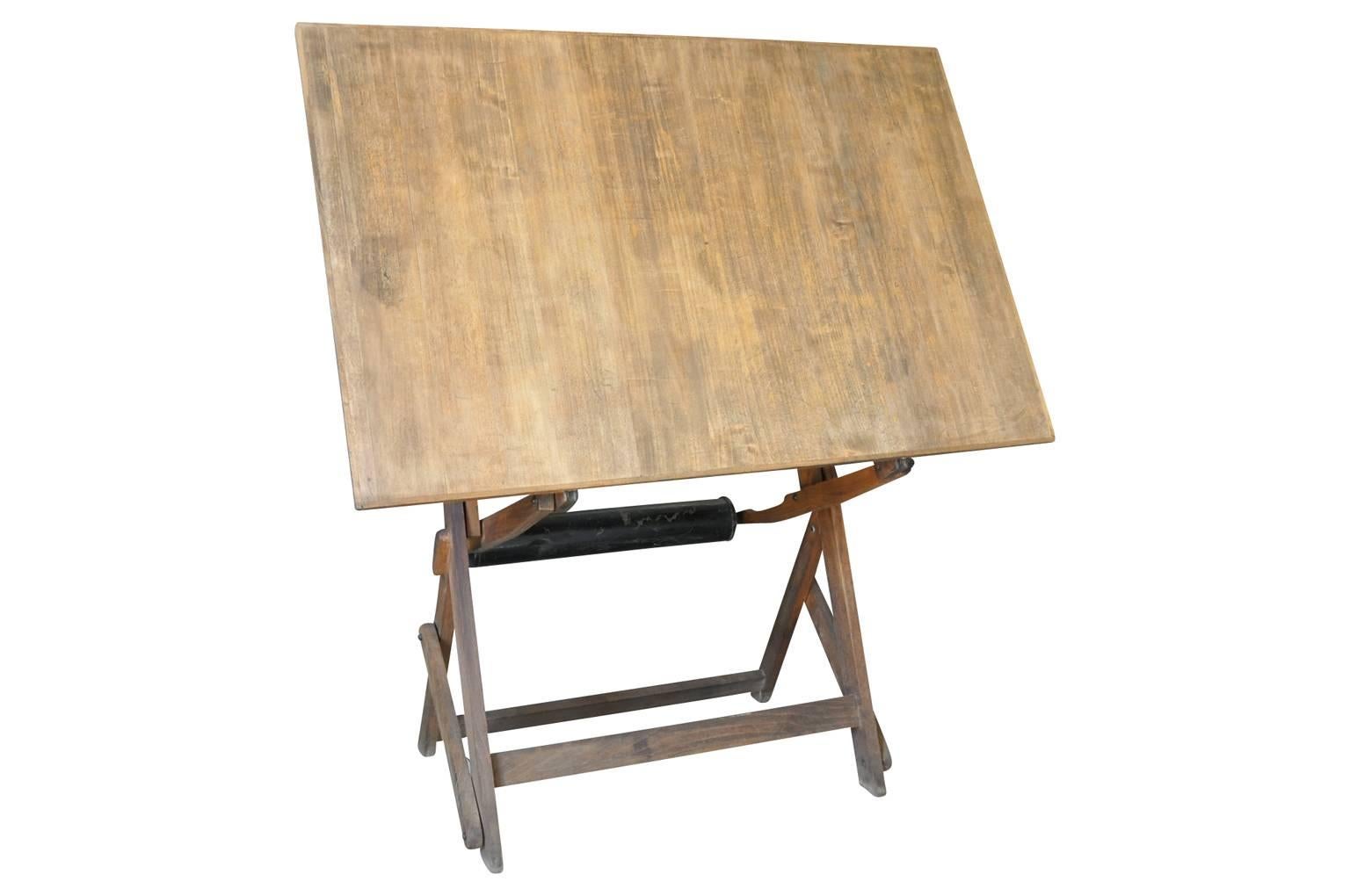 A wonderful early 20th century drafting table, architect's drawing table from France. Soundly constructed in beechwood. Not only great to draw from but a terrific decorative piece that serves beautifully as an easel for the display of a painting -