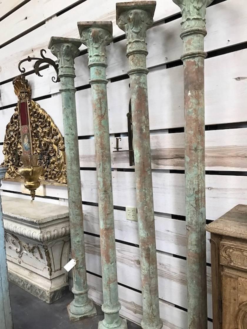 A sensational set of four Spanish columns in cast iron, with their original painted finish. Super patina. Wonderful as an interior or exterior accent.