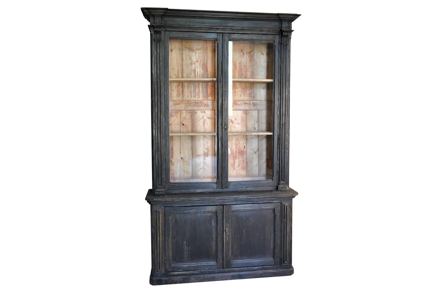 A very handsome mid-19th century Deux Corps Bibliotheque, bookcase from the South of France. Wonderfully constructed from painted wood with beautiful wavy glass panels. A great piece for display and storage. Wonderful in a kitchen or any living