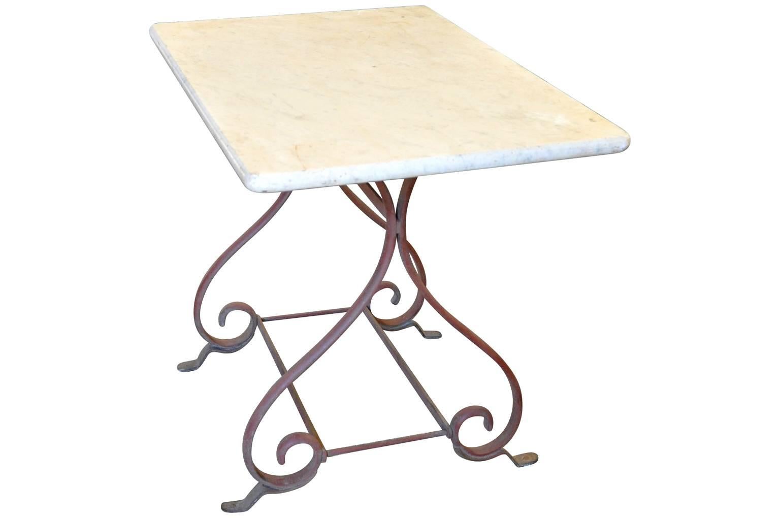 French 19th century butcher table in painted cast iron with its original marble top from the Provenance area in France. These wonderful tables were originally used in the butcher shops to display meat from. A fabulous piece as a kitchen island or
