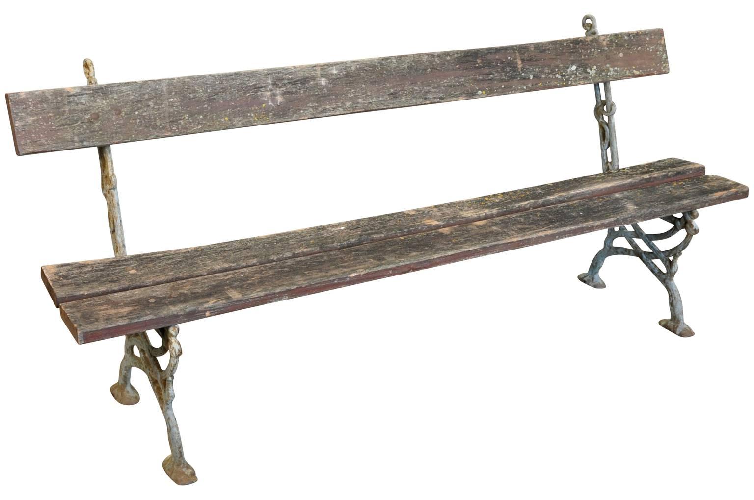 A delightful pair of late 19th century garden benches from the South of France. Soundly constructed from cast iron and oak. Fabulous patina. The benches may be sold separately. The price per bench is $2438.